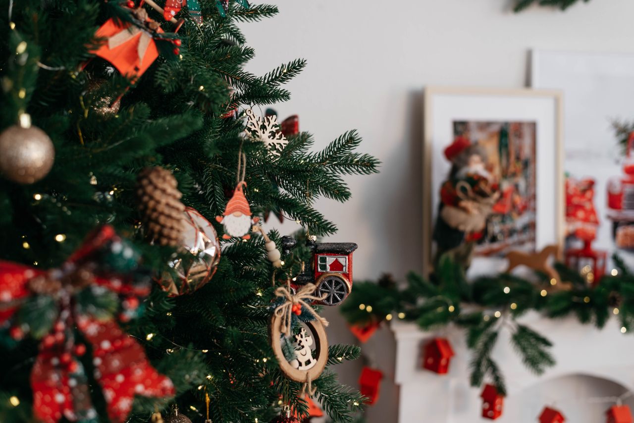 Crafting Captivating Headlines: Your awesome post title goes here Christmas tree with ornaments and fireplace decorations creating a cozy festive atmosphere.